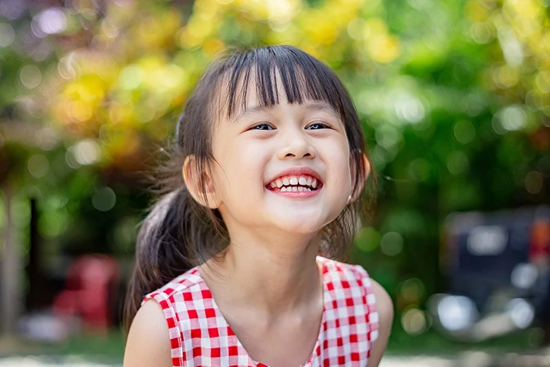 Little girl with a big toothy smile